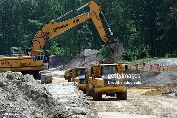 Contractor Loading 360 Contractor Loading Truck Stock Photos, High-Res Pictures, and ...