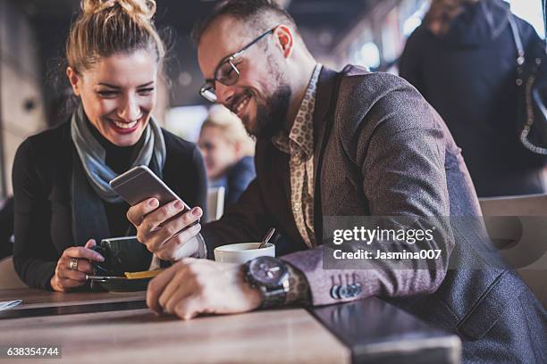 freunden spaß im café - couple in cafe man beard coffee stock-fotos und bilder