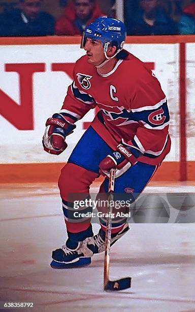 Guy Carbonneau of the Montreal Canadiens turns up ice against the Toronto Maple Leafs during NHL game action on December 9, 1991 at Maple Leaf...