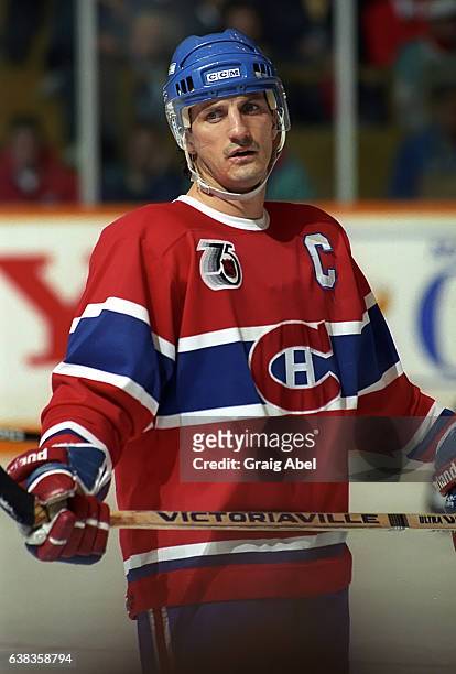 Guy Carbonneau of the Montreal Canadiens prepares for the face-off against the Toronto Maple Leafs during NHL game action on December 9, 1991 at...