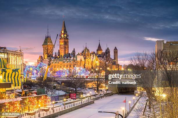 parliament building shot from rideau canal during sunset - ottawa landscape stock pictures, royalty-free photos & images