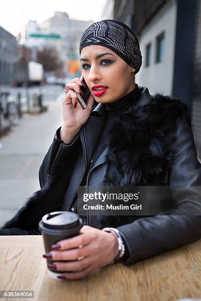#muslimgirl on the phone with coffee - outdoor cafe nyc stock pictures, royalty-free photos & images