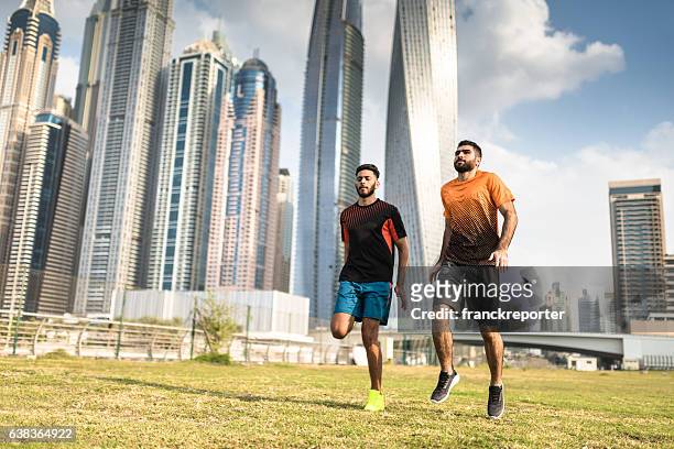 fitness friends doing skip on the park in dubai - dubai fitness stock pictures, royalty-free photos & images