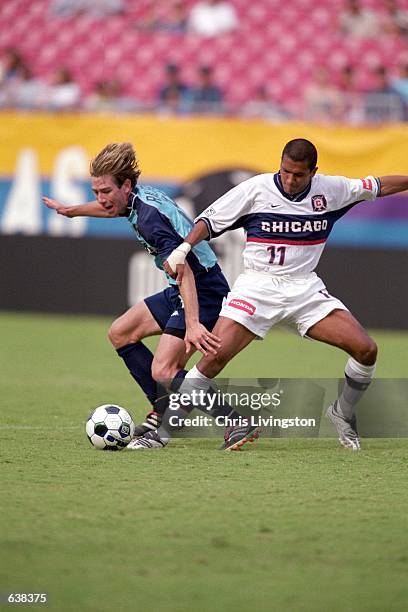 Steve Ralston of the Tampa Bay Mutiny goes head to head against Diego Gutierrez of the Chicago Fire for control over the ball during the game at the...