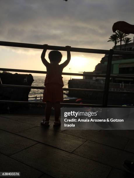 little girl in puerto naos at sunset. la palma island, canary islands, spain - puerto naos stock pictures, royalty-free photos & images
