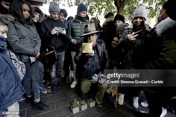 German artist Gunter Denming installs the stumbling blocks in Via Acqua Bullicante in Torpignattara in front of the house of partisan Valerio...