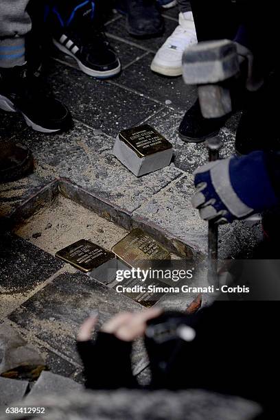 German artist Gunter Denming installs the stumbling blocks in Via Acqua Bullicante in Torpignattara in front of the house of partisan Valerio...