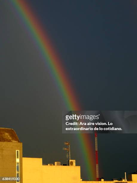 rainbow in the city - nube de tormenta stock pictures, royalty-free photos & images