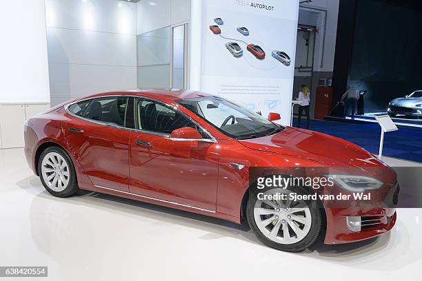 tesla model s 75d all-electric luxury saloon car side view - red car wire stock pictures, royalty-free photos & images