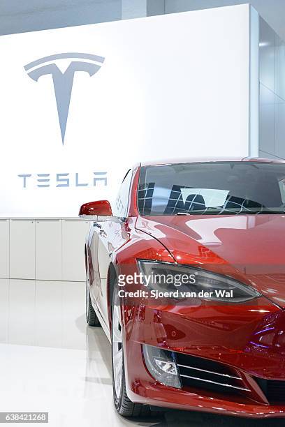 tesla model s 75d all-electric luxury saloon car front view - red car wire stock pictures, royalty-free photos & images