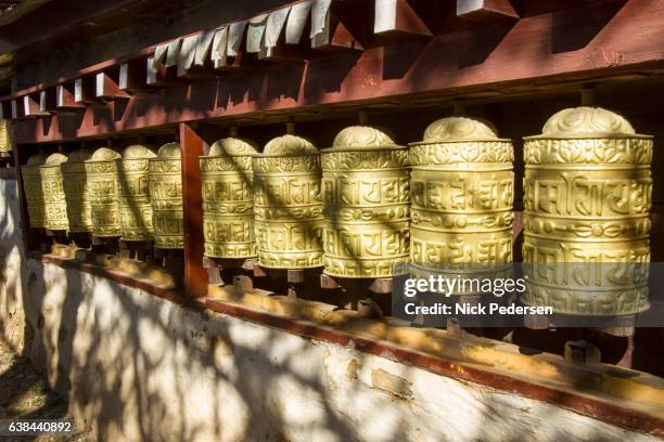 buddhist prayer wheels at namche bazaar - namche bazaar stock pictures, royalty-free photos & images