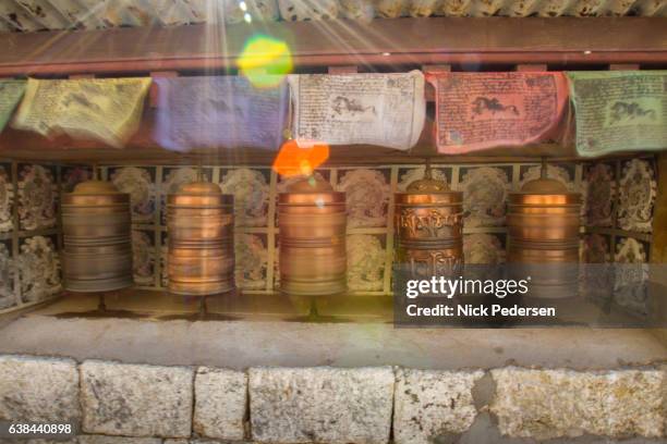 buddhist prayer wheels at namche bazaar - khumbu stockfoto's en -beelden