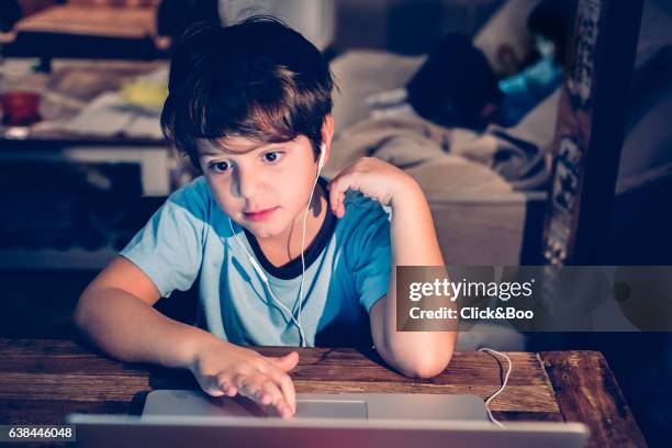 boy working with a computer - new technologies - película stockfoto's en -beelden