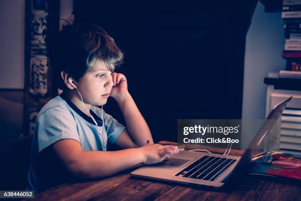 boy working with a computer - new technologies - tecnología foto e immagini stock