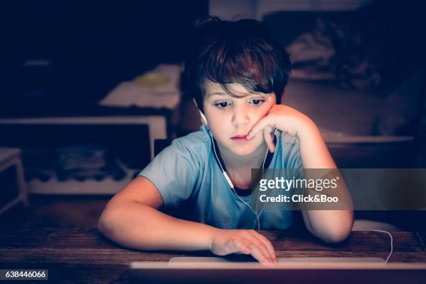 boy working with a computer - new technologies - auriculares stock pictures, royalty-free photos & images