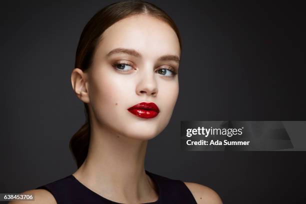 young beautiful woman with red glossy lips - sinnlichkeit stock pictures, royalty-free photos & images