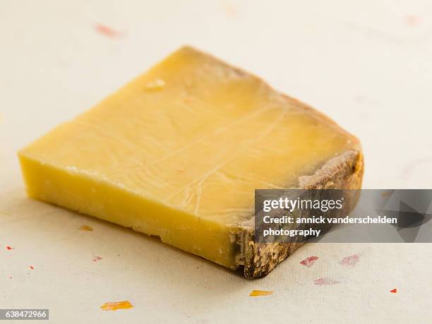 piece of cantal cheese. - cantal stock pictures, royalty-free photos & images