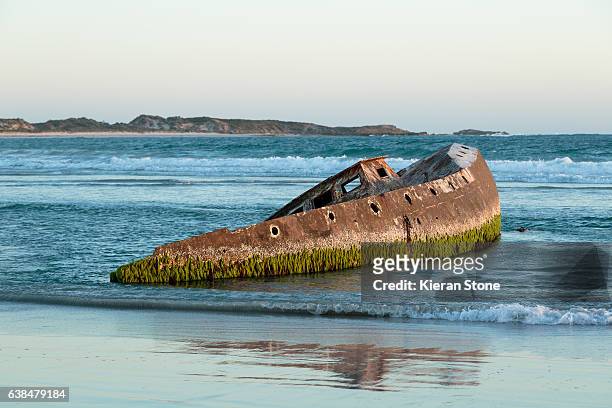 shipwreck at low tide - ship wreck stock pictures, royalty-free photos & images
