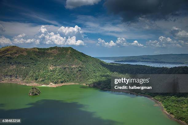 fluffy clouds over taal lake - taal volcano 個照片及圖片檔