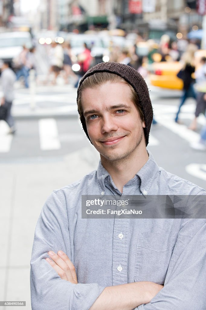 Portrait of young Caucasian man in downtown city