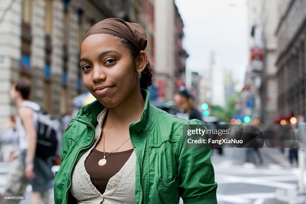 Portrait of young Hispanic woman in downtown city