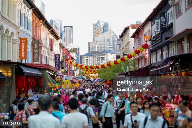 chinese new year 2017 in singapore chinatown - food street market stock pictures, royalty-free photos & images