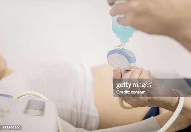 applying gel on transducer - transducer stock pictures, royalty-free photos & images
