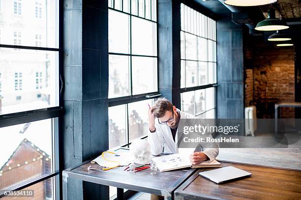 doctor working on medical research - college for creative studies stock pictures, royalty-free photos & images