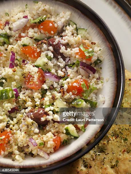 greek salad with couscous and flat bread - tabbouleh stock pictures, royalty-free photos & images
