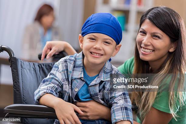 young male cancer patient waits in waiting room - cancer illness stock pictures, royalty-free photos & images