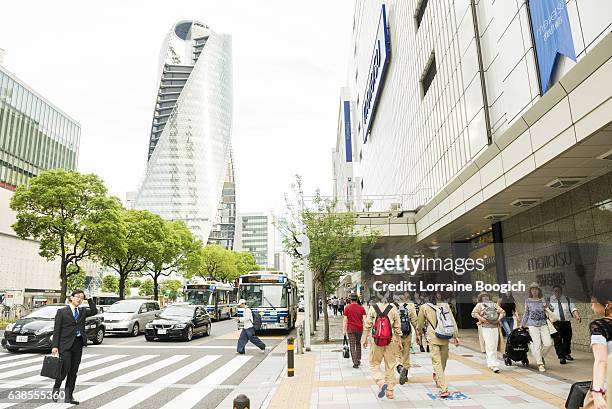 japanese people walking acoss crowded crosswalk at nagoya street intersection - nagoya stock pictures, royalty-free photos & images