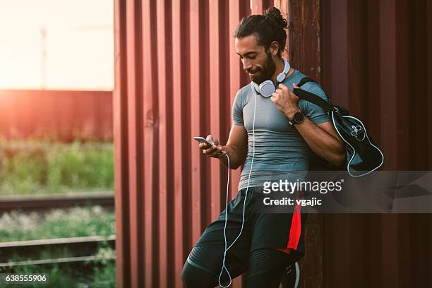 man resting after running. - sportswear stock pictures, royalty-free photos & images