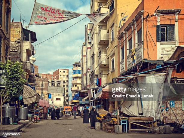 view of local market in a backstreet of alexandria, egypt - alexandria egypt stock-fotos und bilder