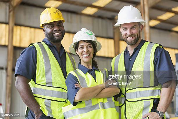 construction crew with female boss - confident young man at work stock pictures, royalty-free photos & images