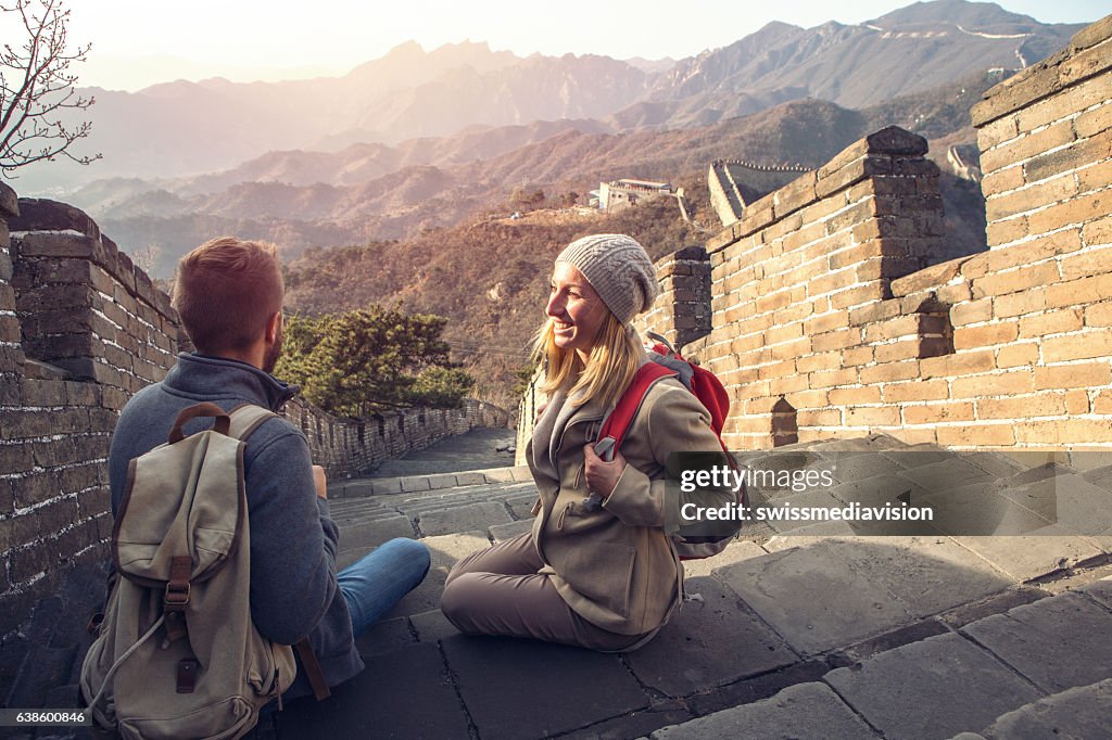 Young couple on top of the Great Wall of China