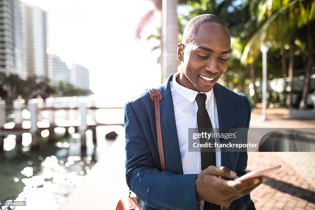 Businessman texting in miami