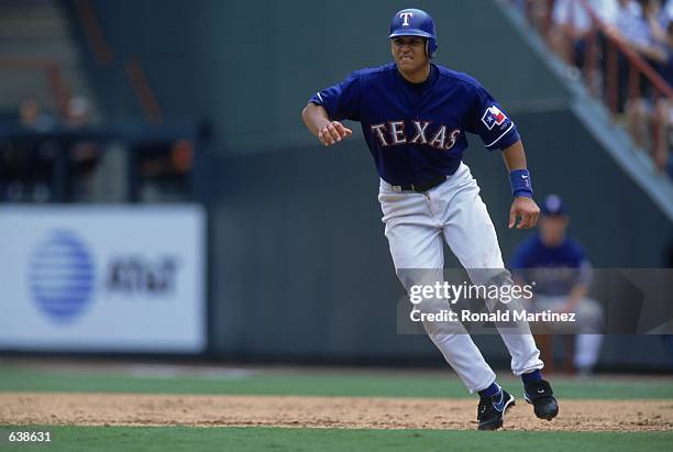 Alex Rodriguez of the Texas Rangers leads off base during the game against the Detroit Tigers at The Ballpark in Arlington, Texas. The Tigers...