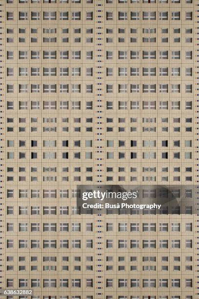 impossible architectures: digital manipulation of rows of windows of an unrenovated plattanbau building in berlin mitte, close to alexanderplatz - berlin modernism housing estates stock pictures, royalty-free photos & images