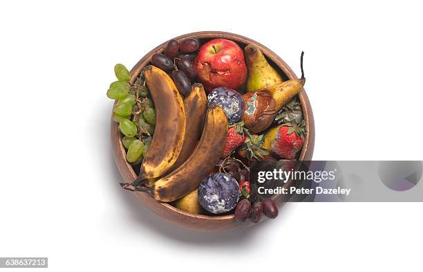 rotting fruit in bowl - fruit decay stockfoto's en -beelden