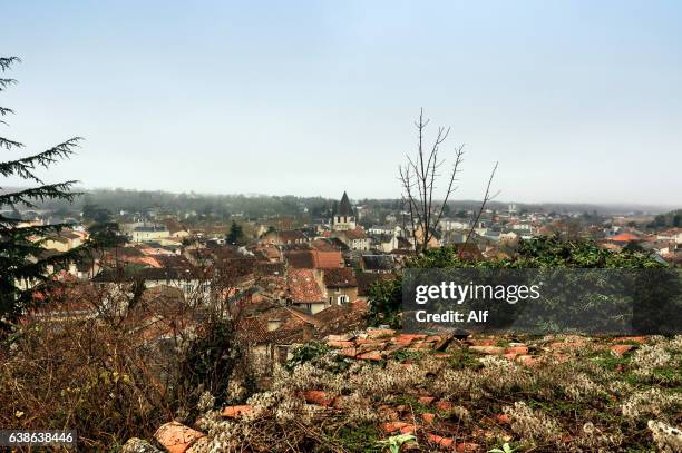 view of the roofs of the city and bell tower of the notre-dame church in chauvigny, france - chauvigny fotografías e imágenes de stock