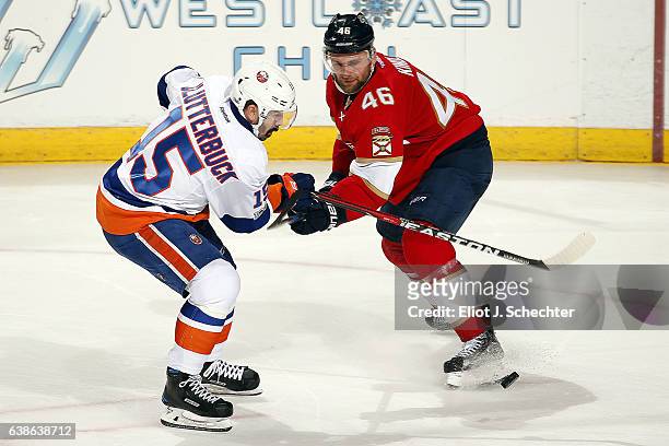 Cal Clutterbuck of the New York Islanders tangles with Jakub Kindl of the Florida Panthers at the BB&T Center on January 13, 2017 in Sunrise, Florida.