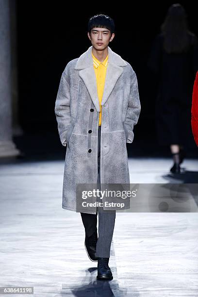 Model walks the runway at the Neil Barrett show during Milan Men's Fashion Week Fall/Winter 2017/18 on January 14, 2017 in Milan, Italy.