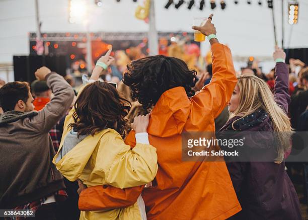 couple at a festival - marquee stock pictures, royalty-free photos & images