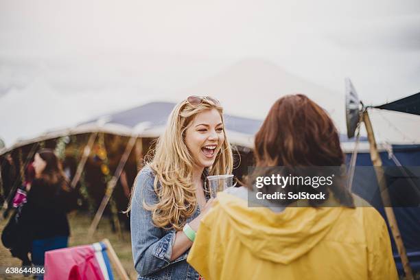 happy festival-goer - entertainment tent stock pictures, royalty-free photos & images