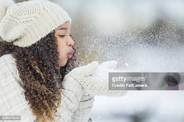 playing with snow outside - black glove stock pictures, royalty-free photos & images