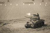World War 2 Sherman Tank Firing Weapon on Battle Field