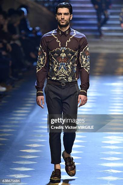 Model walks the runway at the Dolce & Gabbana show during Milan Men's Fashion Week Fall/Winter 2017/18 on January 14, 2017 in Milan, Italy.