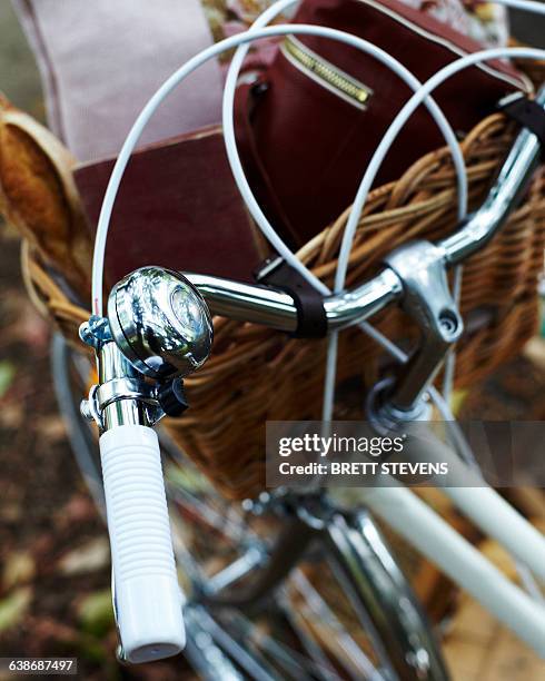 high angle close up of bicycle handles bars and handle bar basket - bike handle stock pictures, royalty-free photos & images