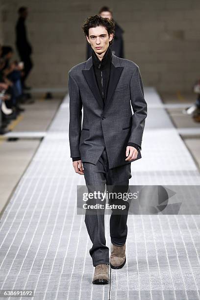 Model walks the runway at the Dirk Bikkembergs show during Milan Men's Fashion Week Fall/Winter 2017/18 on January 15, 2017 in Milan, Italy.