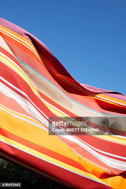 close up of striped fabric of windbreaker outdoors - windbreak stock pictures, royalty-free photos & images